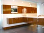 Vertically grained high-gloss laminate creates a striking kitchen.